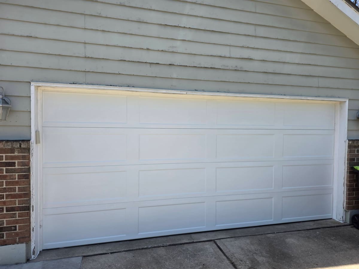 Brand new white garage door installed by American Standard Garage Door KC