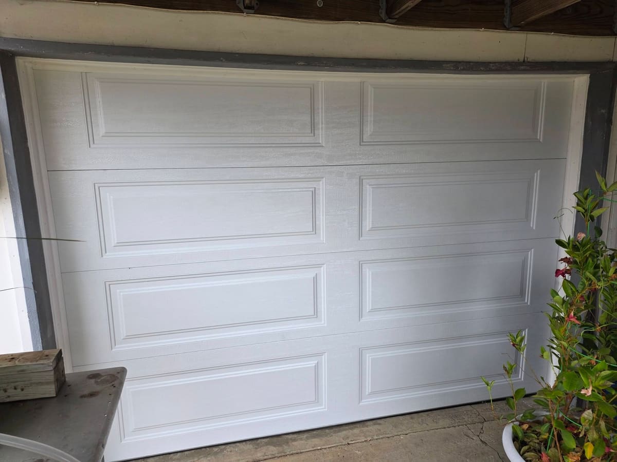 Clean new garage door installed after replacement